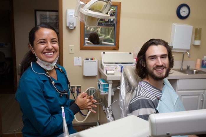 assistant and patient smiling